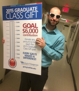 Richard Amantia holds a poster for the 2015 Graduate Class Gift