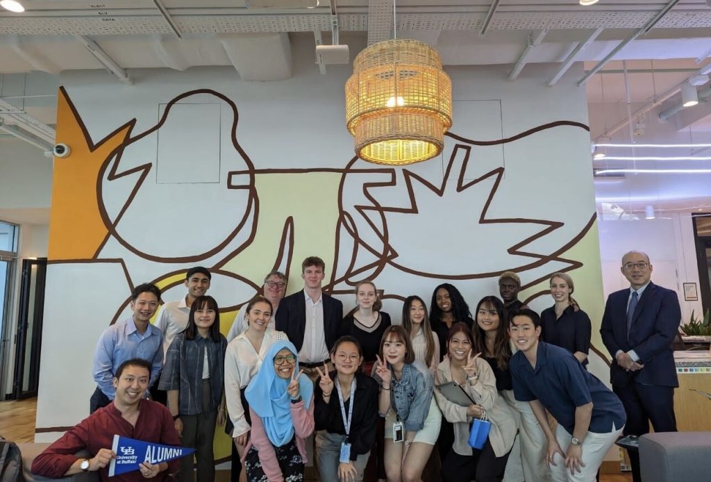 Students in front of mural at Google