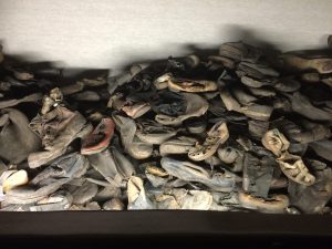 Confiscated shoes of the inmates behind glass