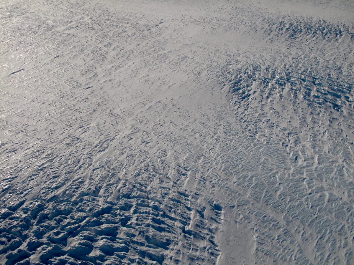 Crevasses and snow in western Greenland; white and blue with texture