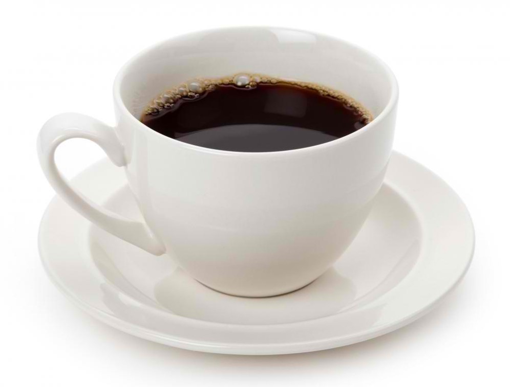 Cup of black coffee in white mug on white saucer