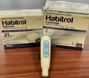 Boxes of nicotine patches and lozenges with iCO quit monitor which is used to measure the amount of carbon monoxide in someone's breath. These medications and this device are used for the RISE Study.