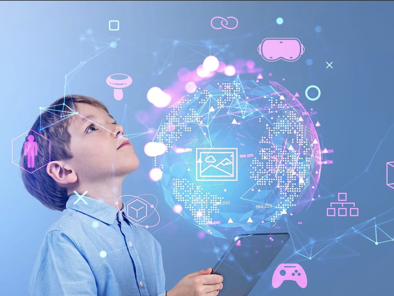 A young boy holding a tablet computer