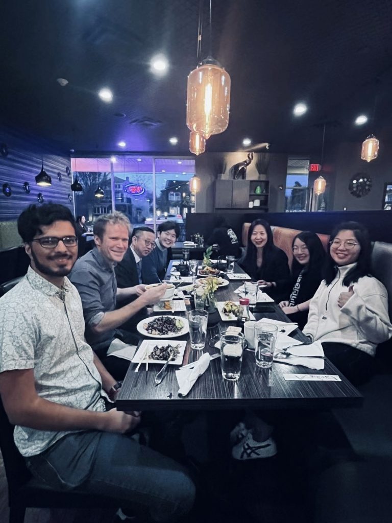 Dr. Li dining with members of the UB GSE community