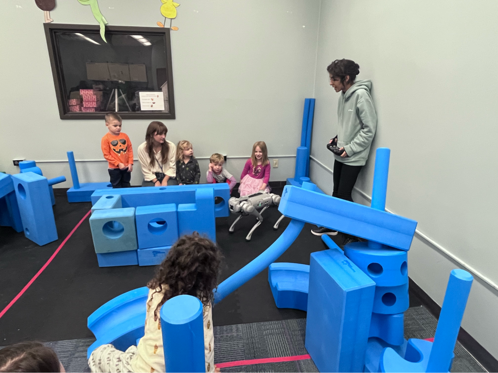 Teachers and students playing with robot