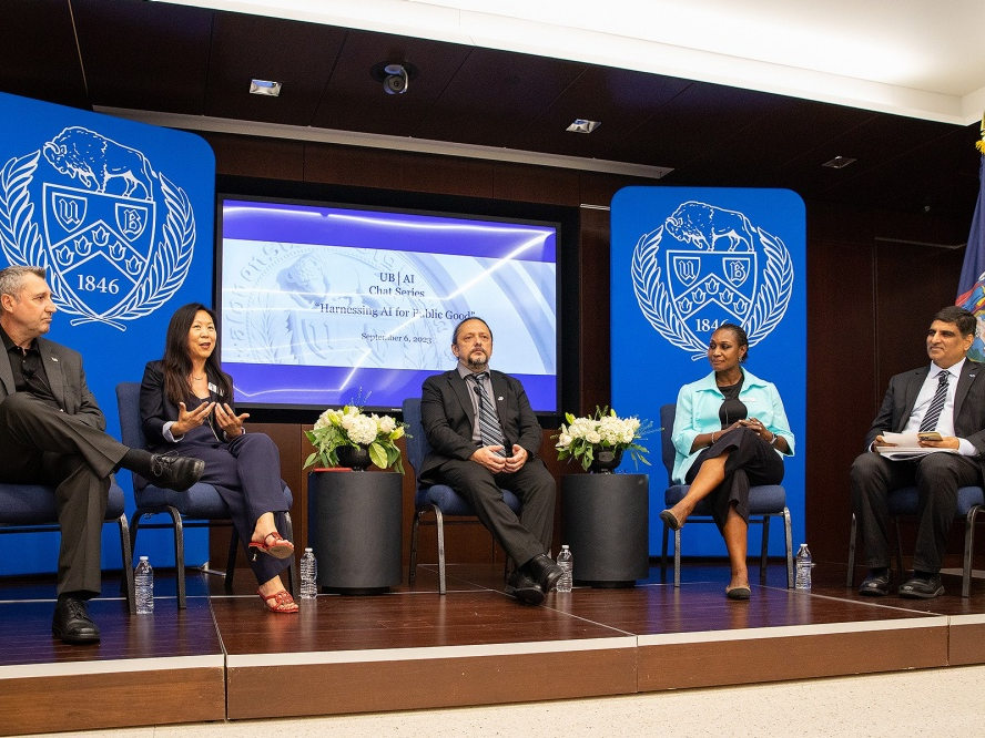 Professors speaking to an audience