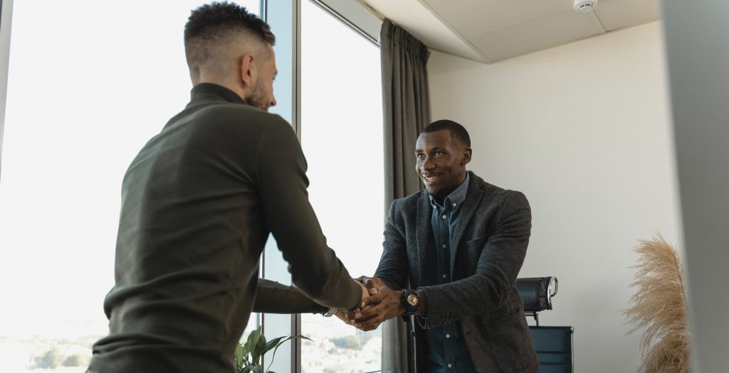 Two professionals come to an agreement after a negotiation.