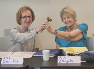 Eras Bechakas handing the gavel to Sue D'Angelo.