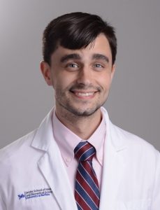 A headshot of Dr. Iacobucci wearing a white lab coat.
