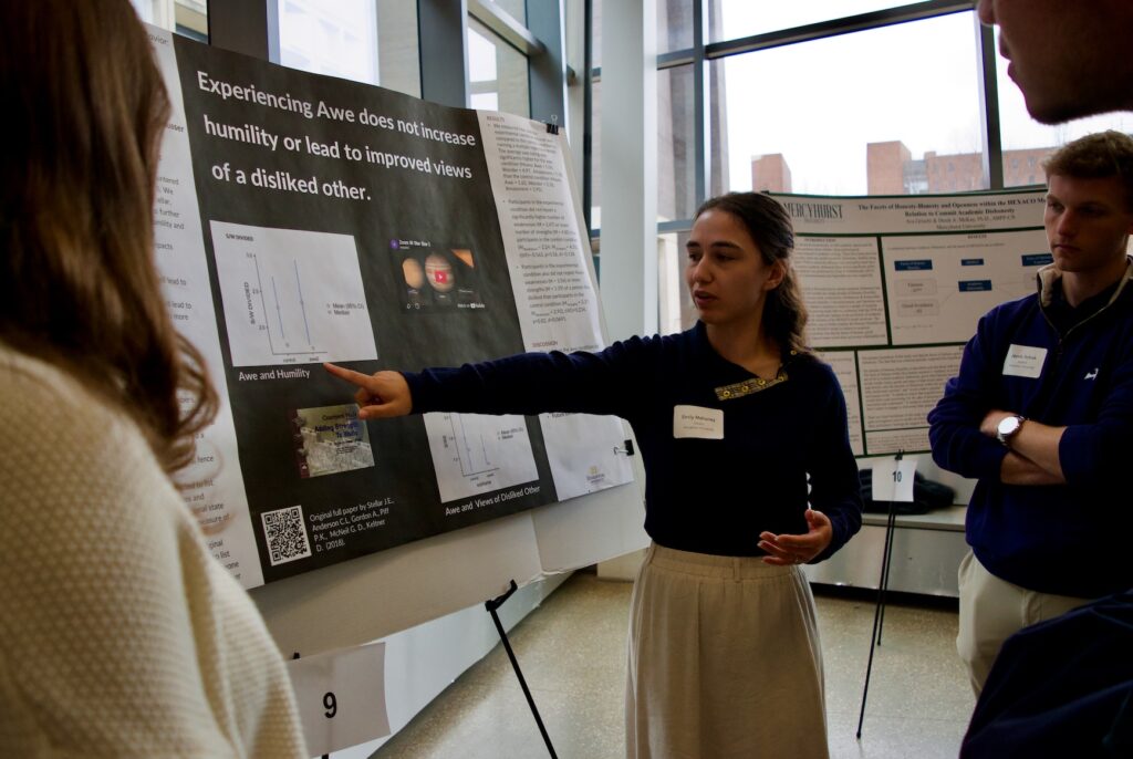 Emily Mahoney presenting their poster