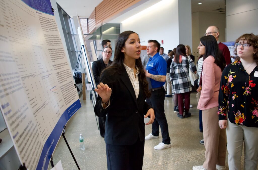 Kenzy Zikry presenting their poster