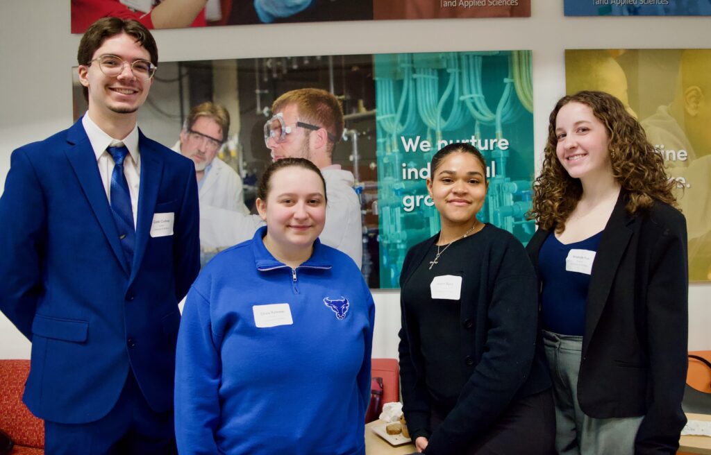 UB Psi Chi officers Caleb Cudney (Vice President), Liv Bylewski (junior officer), Leianni Byrd (Alumni Coordinator), and Amanda Fox (Community Service Coordinator) helping run the WNY Undergraduate Conference