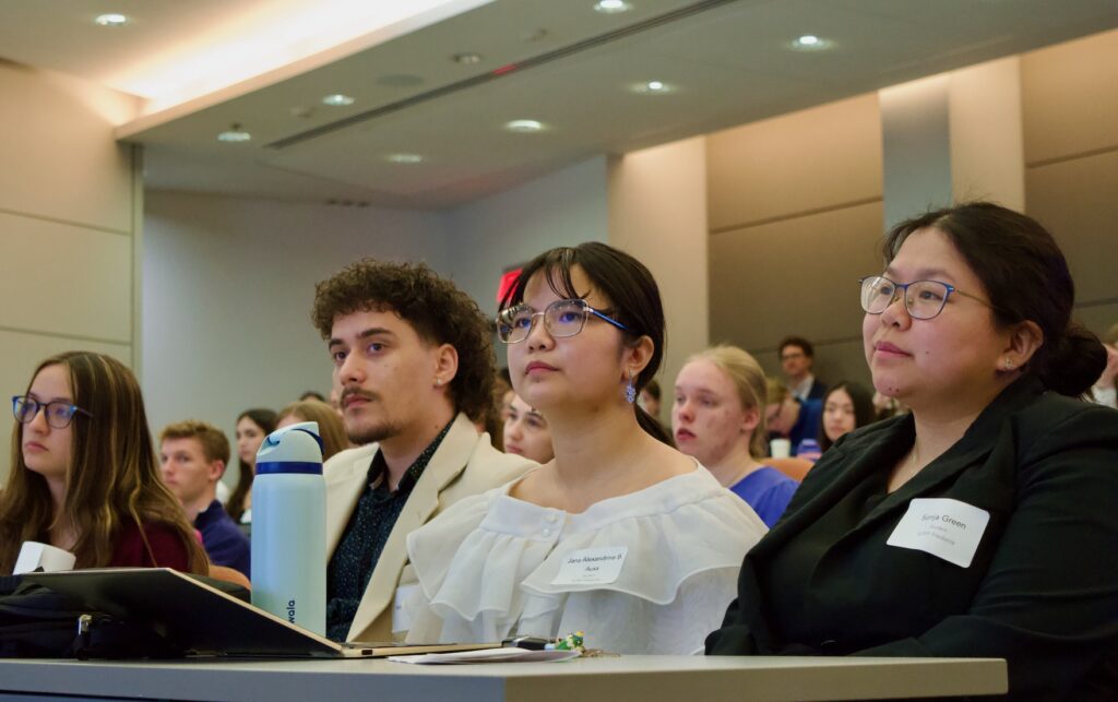 Students listening to oral presentations