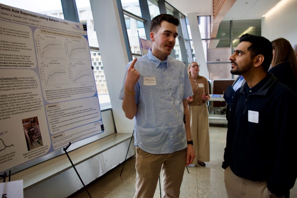 Matthew Graves presenting their poster