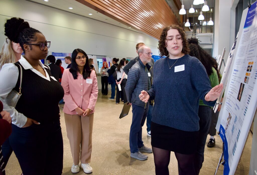 Grave LeVea presenting her poster