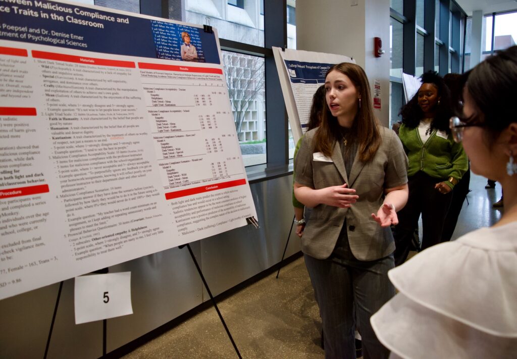 Sydney Fagan presenting their poster