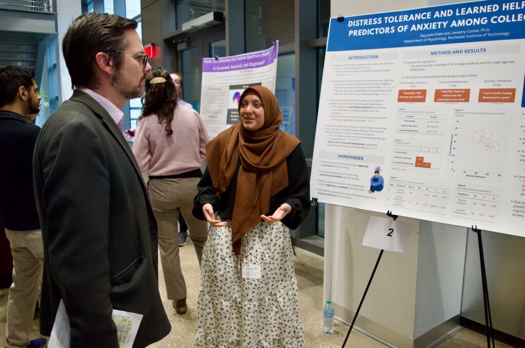 Sayyada Khaki presenting their poster