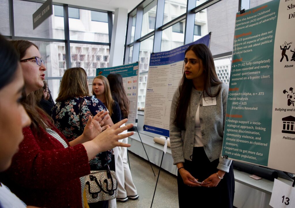Neha Shahzad presenting their poster